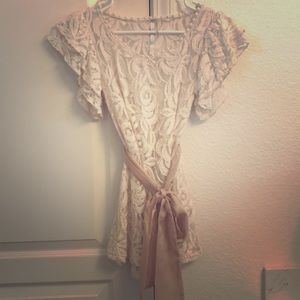 Ivory netted blouse.